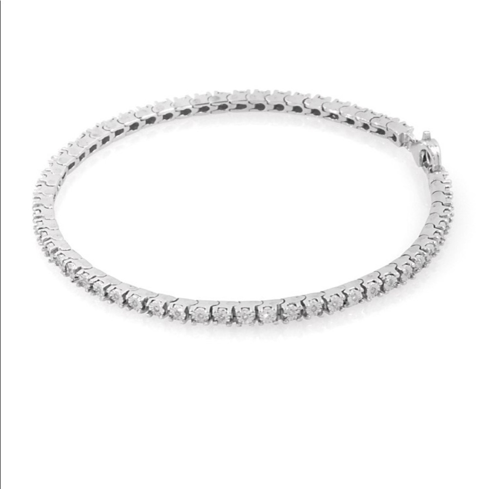 This is a 1/6 carat diamond bracelet  from Kay Jewelers. Sterling Silver